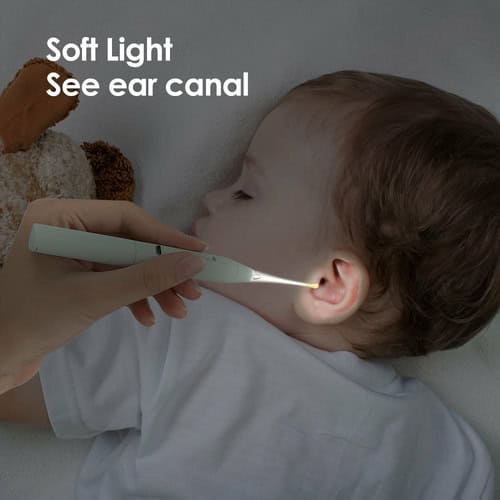 Child using a soft light ear canal inspection tool for ear health.