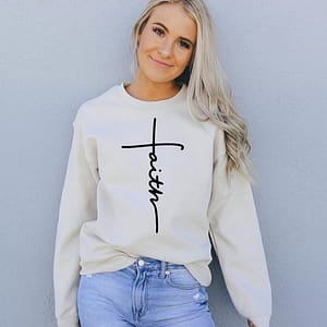 Unshakable Faith graphic sweatshirt for women, featuring a minimalist cross design and inspiring mes.